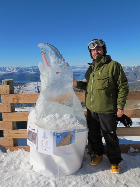 Chris Riley, winner of the ZUMWOHL on Ice sculpting competition, with his cheeky Kea carving at Treble Cone.